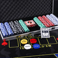 Poker Chips Set with multicoloured patterned chips in an open aluminum case, playing cards and dealer buttons