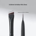 Professional Makeup Brush Set featuring two black brushes with fine synthetic bristles, including an angled head and 0.06 mm tip
