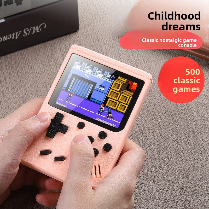 Retro Handheld Game Console in pastel pink plastic with black buttons, textured shell, and colorful game screen.