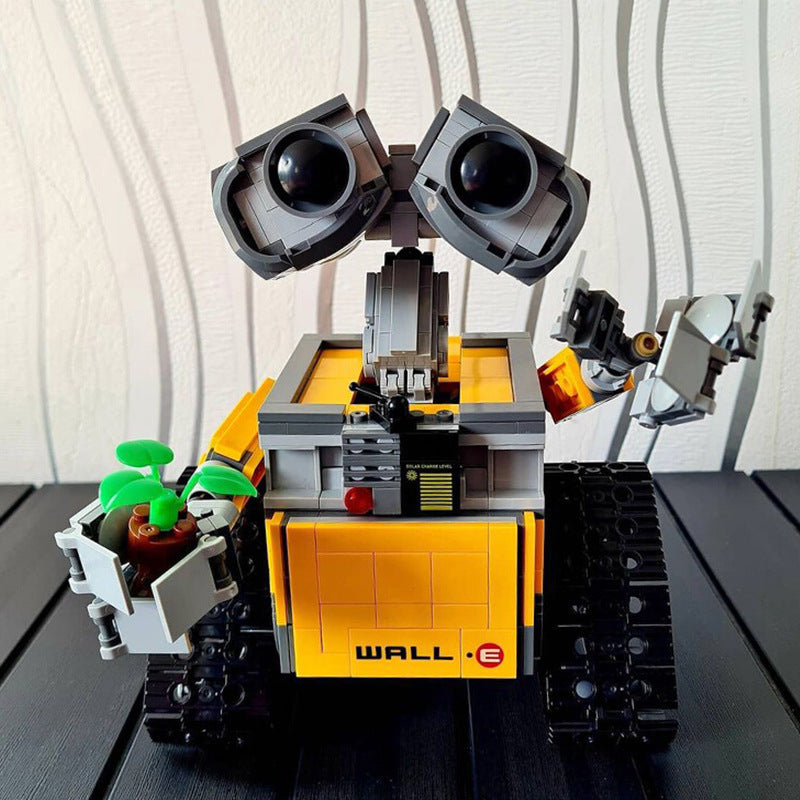 Wall-e Robot Building Blocks feature a block-built robot with a yellow and orange body, gray arms, black treads, and large eyes.