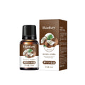 Rose Ginger Mugwort Massage Essential Oil in a small amber glass bottle with black cap, coconut label and matching brown carton