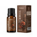 Rose Ginger Mugwort Massage Essential Oil shown as a brown Ganoderma lucidum bottle with a ribbed black cap and matching carton