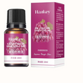 Rose Ginger Mugwort Massage Essential Oil bottle and matching box, labeled grape seed essential oil in vivid magenta packaging