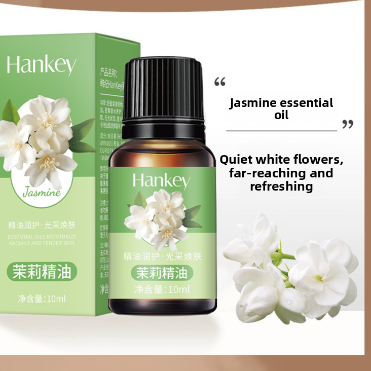 Rose Ginger Mugwort Massage Essential Oil appears as a 10 ml amber bottle with a black ribbed cap and green jasmine flower label.