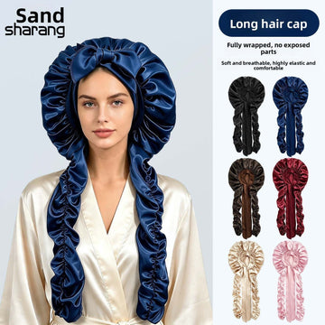 Satin Long Hair Sleeping Bonnet Cap in glossy navy satin, with a gathered dome and long fabric tails framing the face