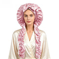 Satin Long Hair Sleeping Bonnet Cap in shiny pink satin, with a gathered dome, bow detail and long ruffled sides