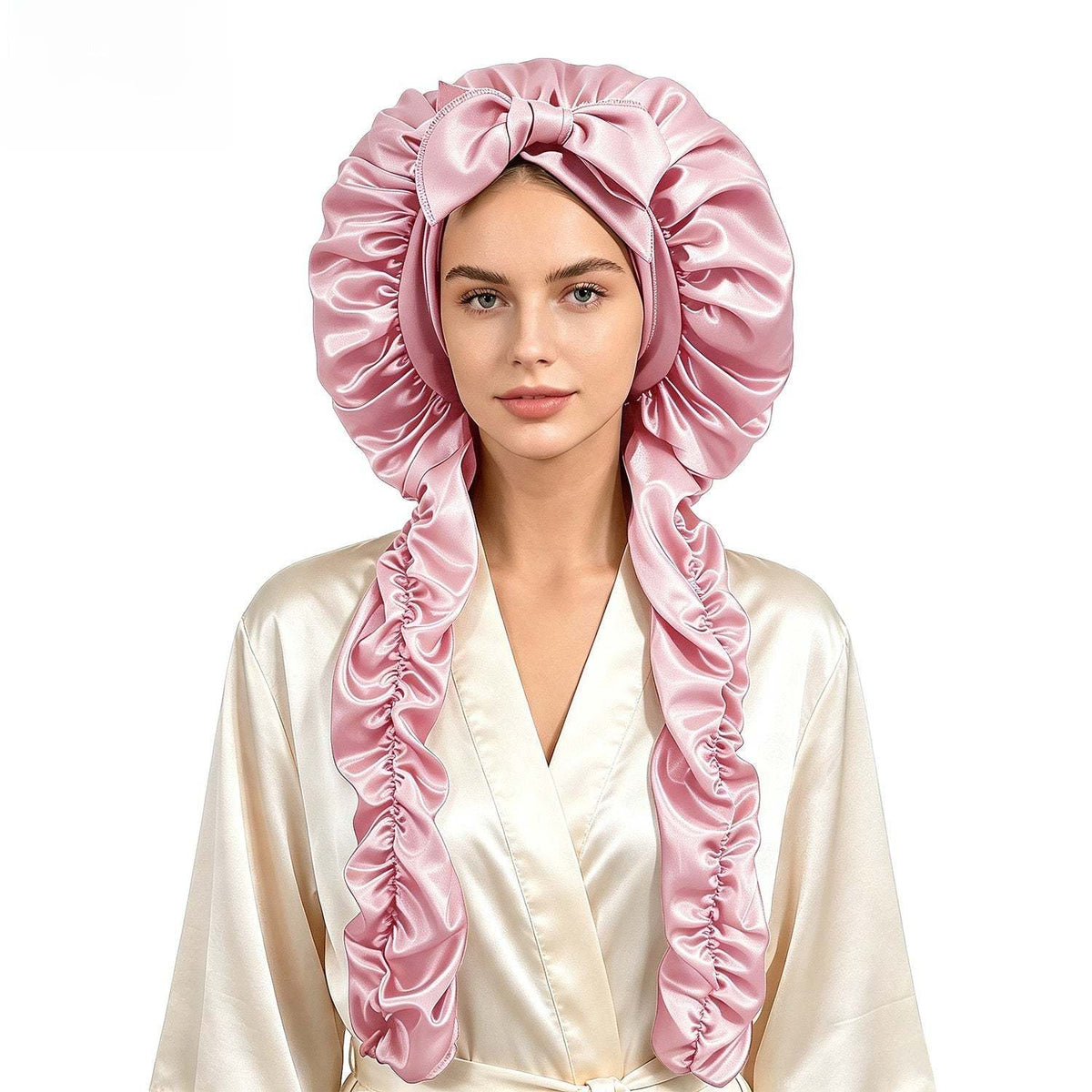 Satin Long Hair Sleeping Bonnet Cap in shiny pink satin, with a gathered dome, bow detail and long ruffled sides