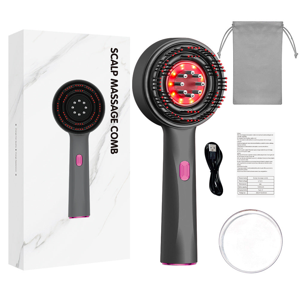 Scalp medicine applicator comb in dark gray with a pink button, circular red-lit massage head and charging accessories.