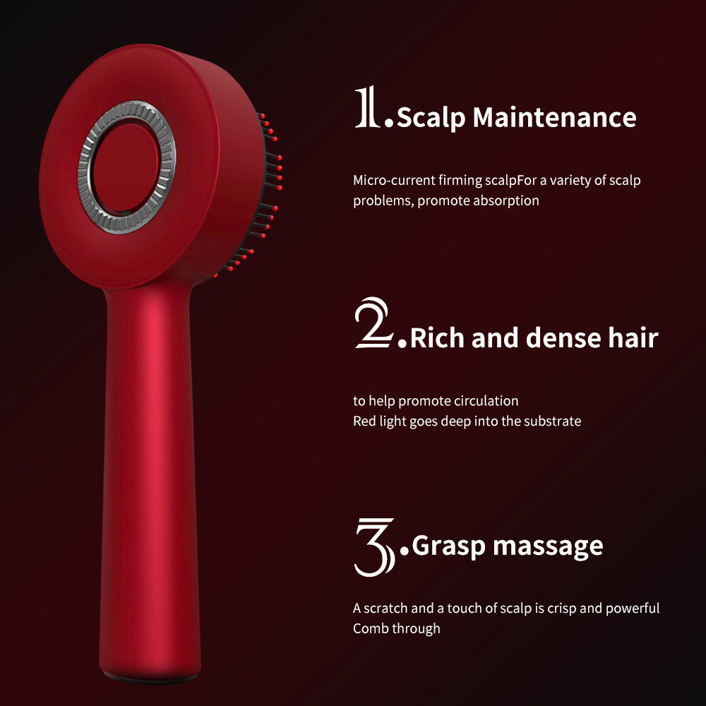Scalp medicine applicator in glossy red with a round head, silver ring, combing pins and elongated handle