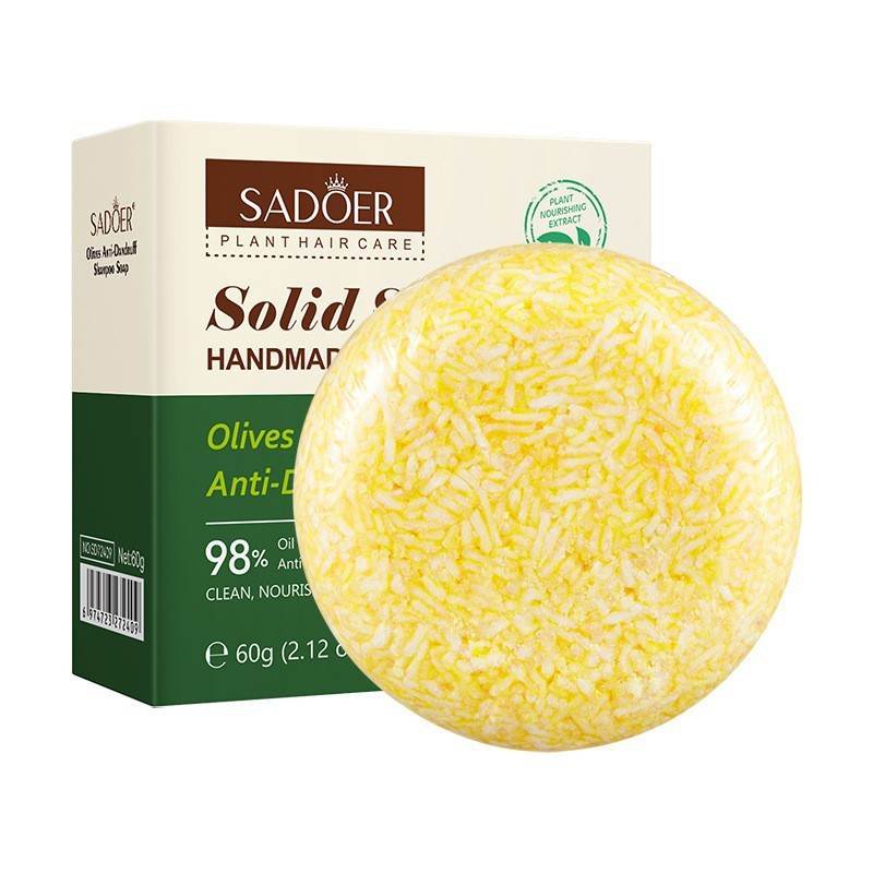 Shampoo Bar with a round yellow-and-white textured solid bar beside a cream and dark green SADOER box.