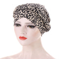 Headscarf cap with Short braids can be hidden, featuring beige fabric and an all-over black leopard print.