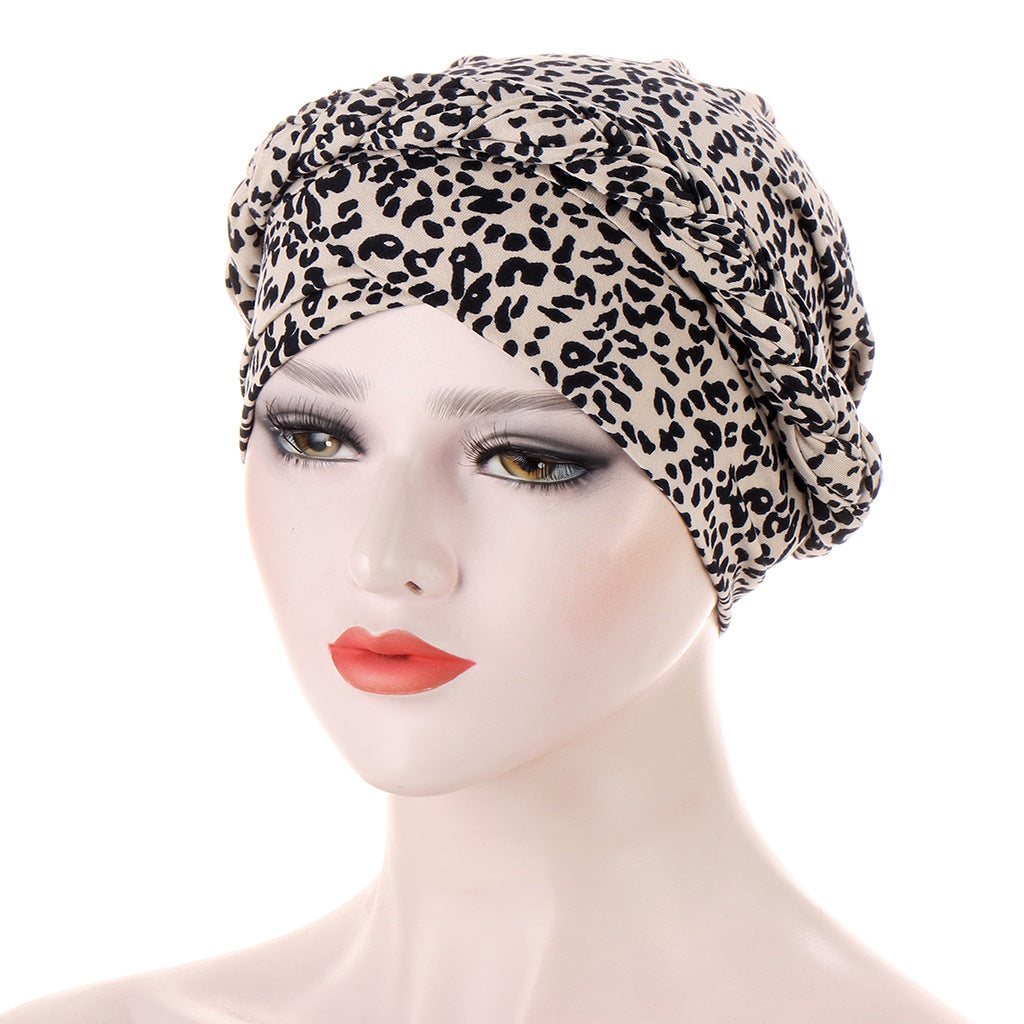 Headscarf cap with Short braids can be hidden, featuring beige fabric and an all-over black leopard print.