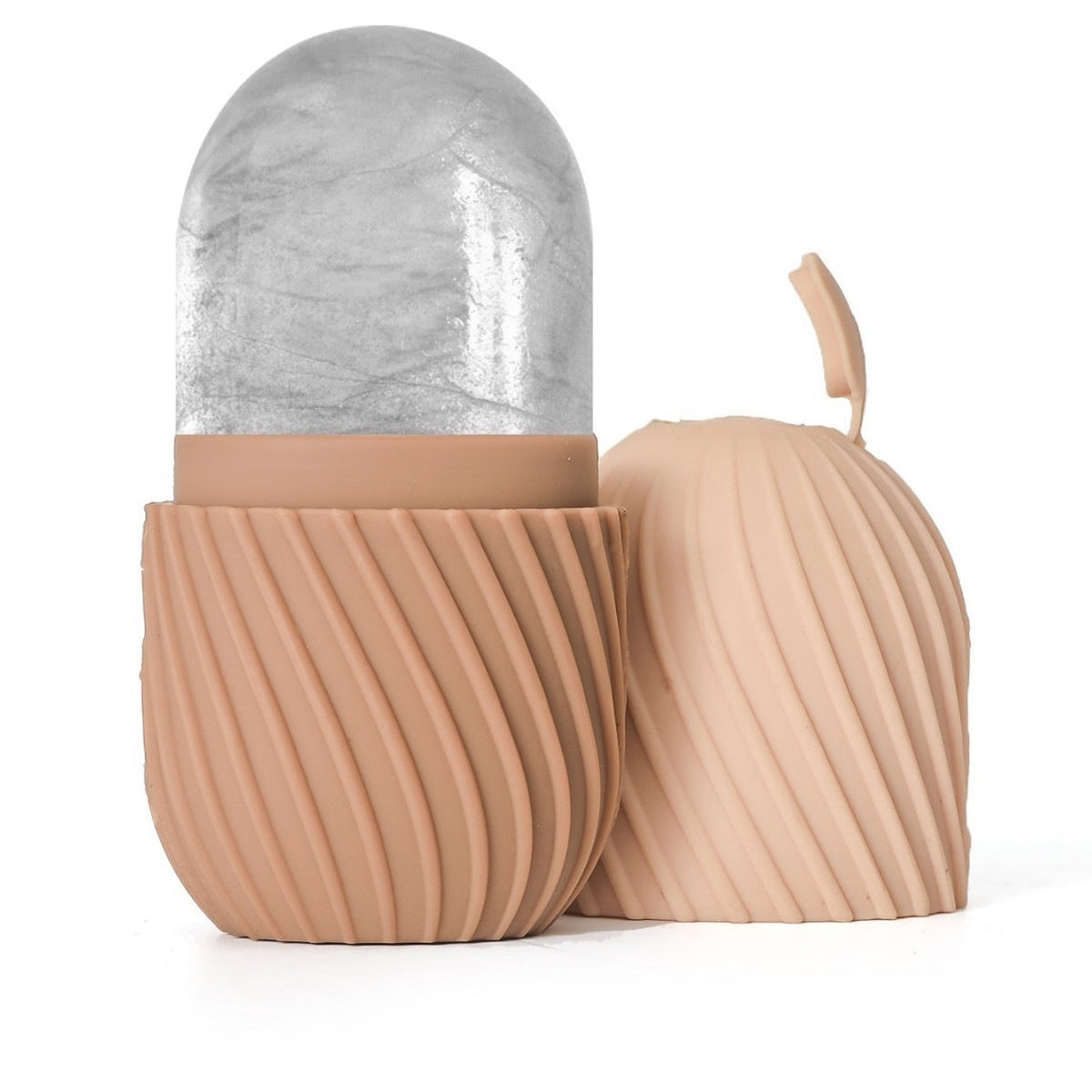 Silicone Ice Pack for Face mini ice roller in peach silicone, with a ribbed grip and clear rounded cooling head