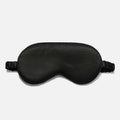 Simulated Silk Sleep Eye Mask in black, with a smooth fabric surface, contoured eye cups and gathered elastic strap.