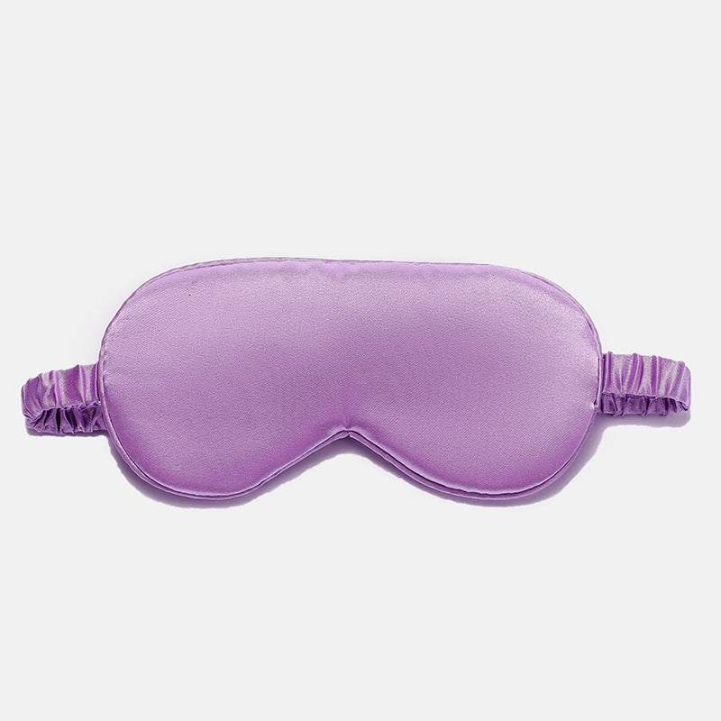 Simulated Silk Sleep Eye Mask in smooth lavender purple fabric with contoured eye cups, stitched edging, and gathered elastic strap