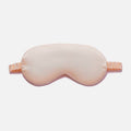 Simulated Silk Sleep Eye Mask in pale peach pink with a smooth fabric surface, contoured shape and gathered elastic strap