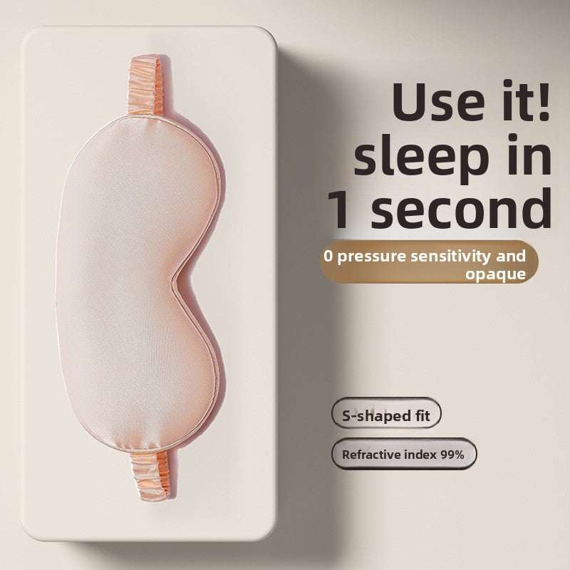 Simulated Silk Sleep Eye Mask in soft peach-pink fabric, with a contoured S-shaped fit and elastic straps