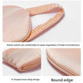 Simulated Silk Sleep Eye Mask in peach pink fabric with elastic gathered bands, a U-shaped nose wing and rounded edges