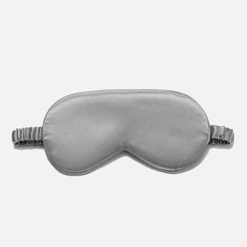 Simulated Silk Sleep Eye Mask in silver gray with a smooth, lightly padded surface, contoured shape and gathered elastic strap