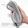 Simulated Silk Sleep Eye Mask in smooth silver-gray fabric, with a contoured shape and gathered elastic strap.