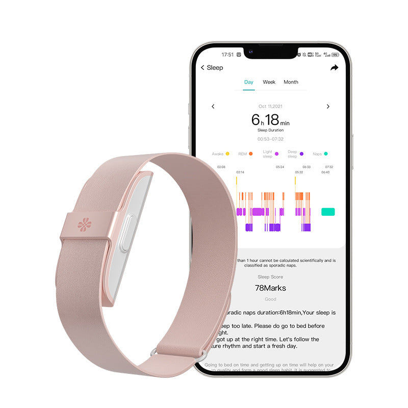Smart Bracelet with Heart Rate monitoring, blush pink silicone band and silver-toned case, shown beside a sleep tracking app on a phone.