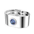Smart Pet Water Fountain with a polished silver stainless steel body, oval basin, raised spout, and round blue water-level window