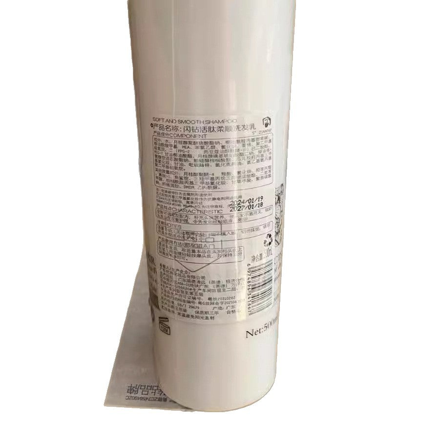 Smoothing Shampoo in a tall white plastic bottle with a smooth finish, dense black product text and barcode on the label