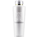 Smoothing Shampoo in a white bottle with a silver pump, raised floral chamomile design and 500 ml capacity