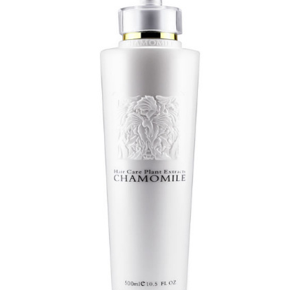 Smoothing Shampoo in a white bottle with a silver pump, raised floral chamomile design and 500 ml capacity