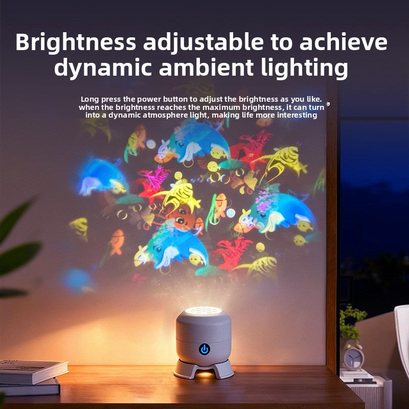 Snowflake Christmas Projection Light in a compact gray housing projects colorful rotating sea-creature patterns