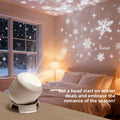 Snowflake Christmas Projection Light with white rounded housing projects bright snowflakes and stars across walls and ceiling