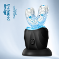 Sonic Electric Toothbrush with black body, clear blue U-shaped brush head, white bristles and black charging base
