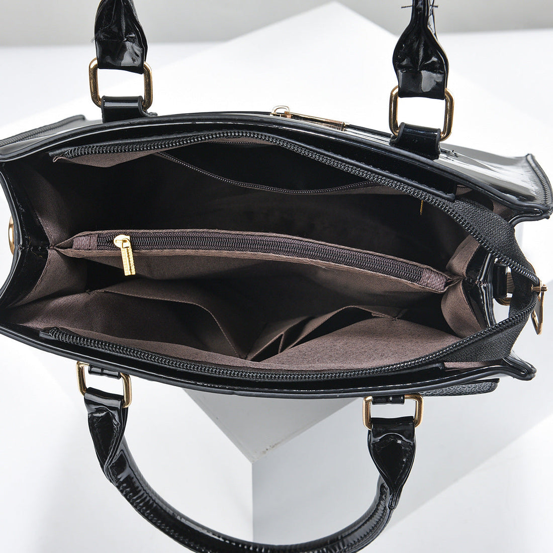 Three-piece handbag set in dark brown faux leather, with croc-textured front pocket, glossy finish and matching wallets; Specialized Design Leather Bags.