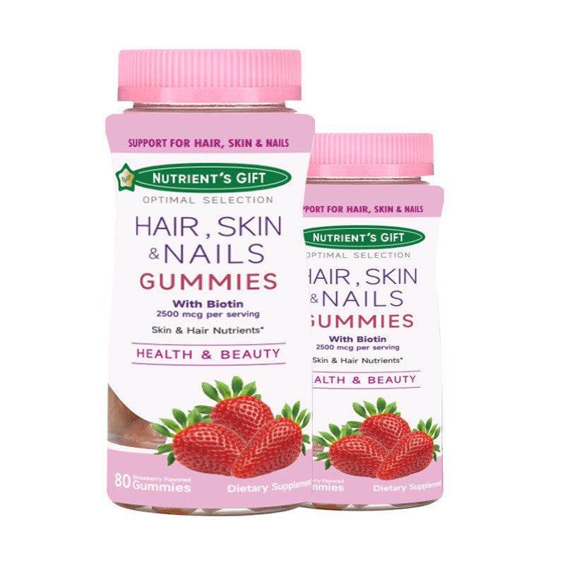 Strawberry Hair Skin & Nails nutrient gummies in pink-lidded bottles, with strawberry and leaf graphics on white labels.