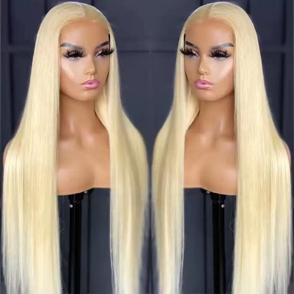 Synthetic Hair Wigs in pale blonde synthetic fiber, worn long, straight and sleek with a subtle center part