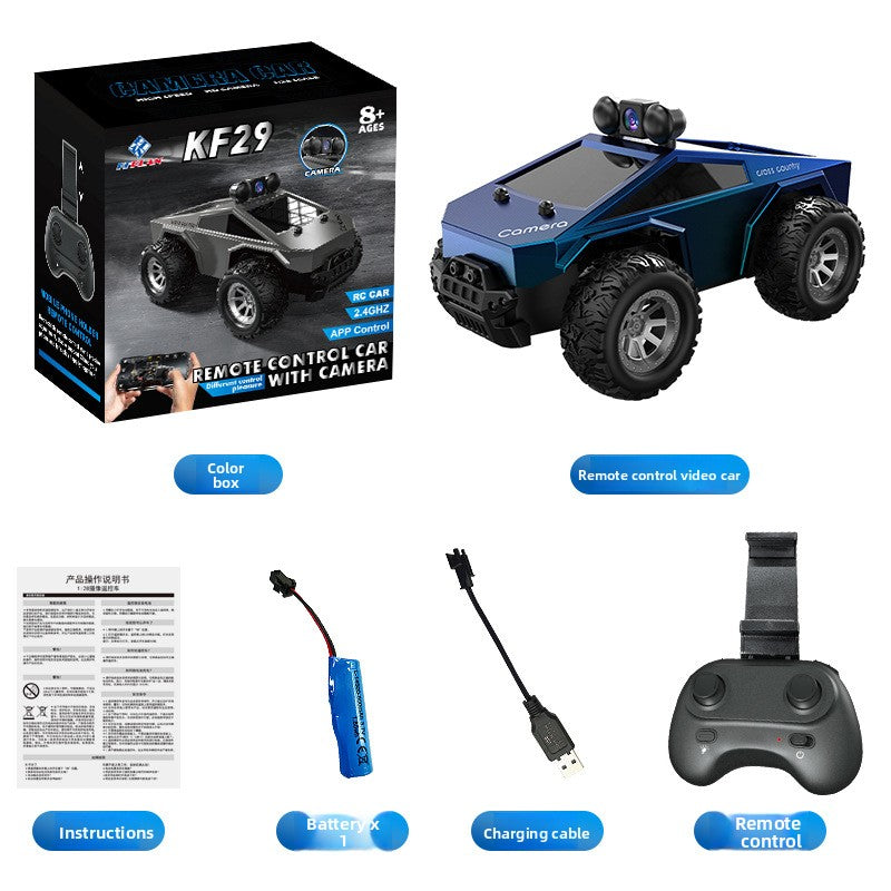 Tesla Toy Truck in blue plastic with black oversized tires, roof-mounted camera, and angular off-road monster styling
