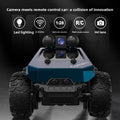 Tesla Toy Truck in blue and silver plastic with oversized treaded tires and a raised camera module