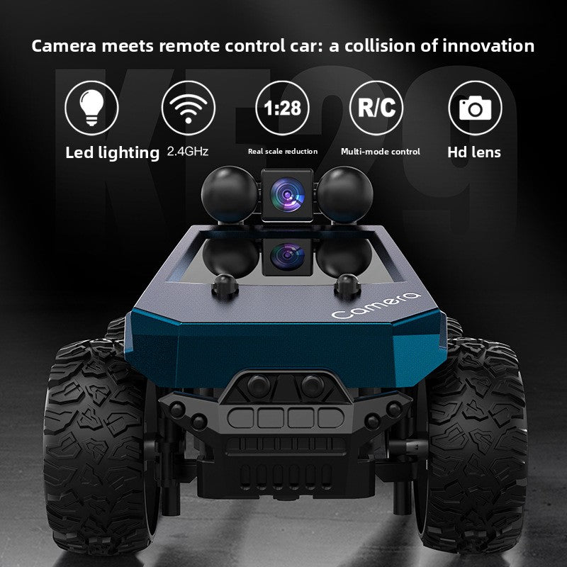 Tesla Toy Truck in blue and silver plastic with oversized treaded tires and a raised camera module