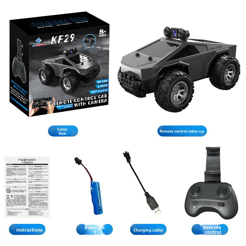 Tesla Toy Truck remote-control monster car in matte dark gray plastic, with oversized rugged tires and a roof-mounted camera.