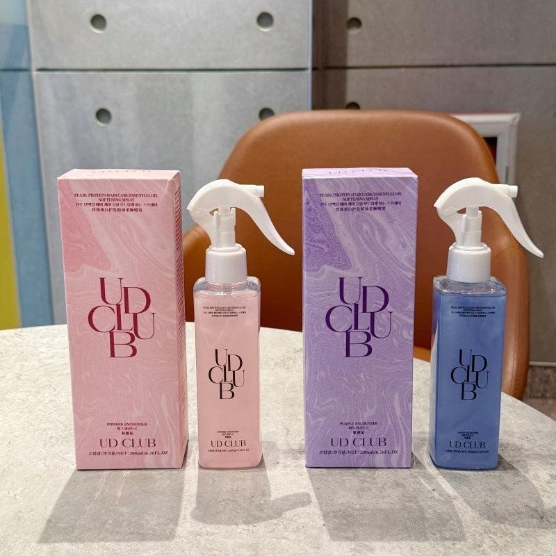 UD CLUB Pearl Protein hair smoothing spray bottles in pink and blue with coordinating patterned boxes and white trigger sprayers
