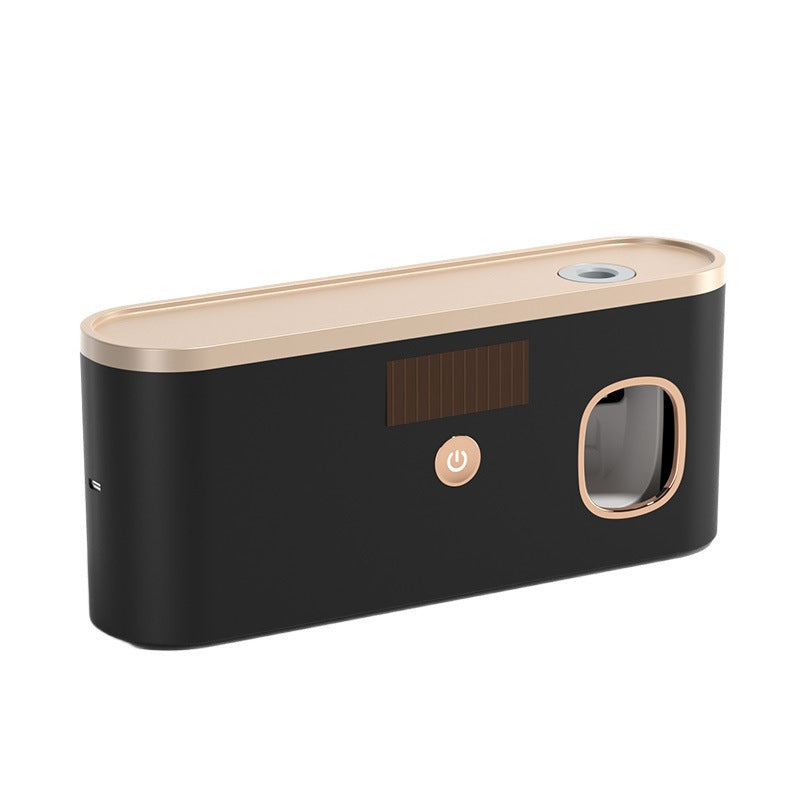 UV Sterilizing Toothbrush Holder in black with a rose-gold top, power button, dark front panel and rounded toothbrush opening