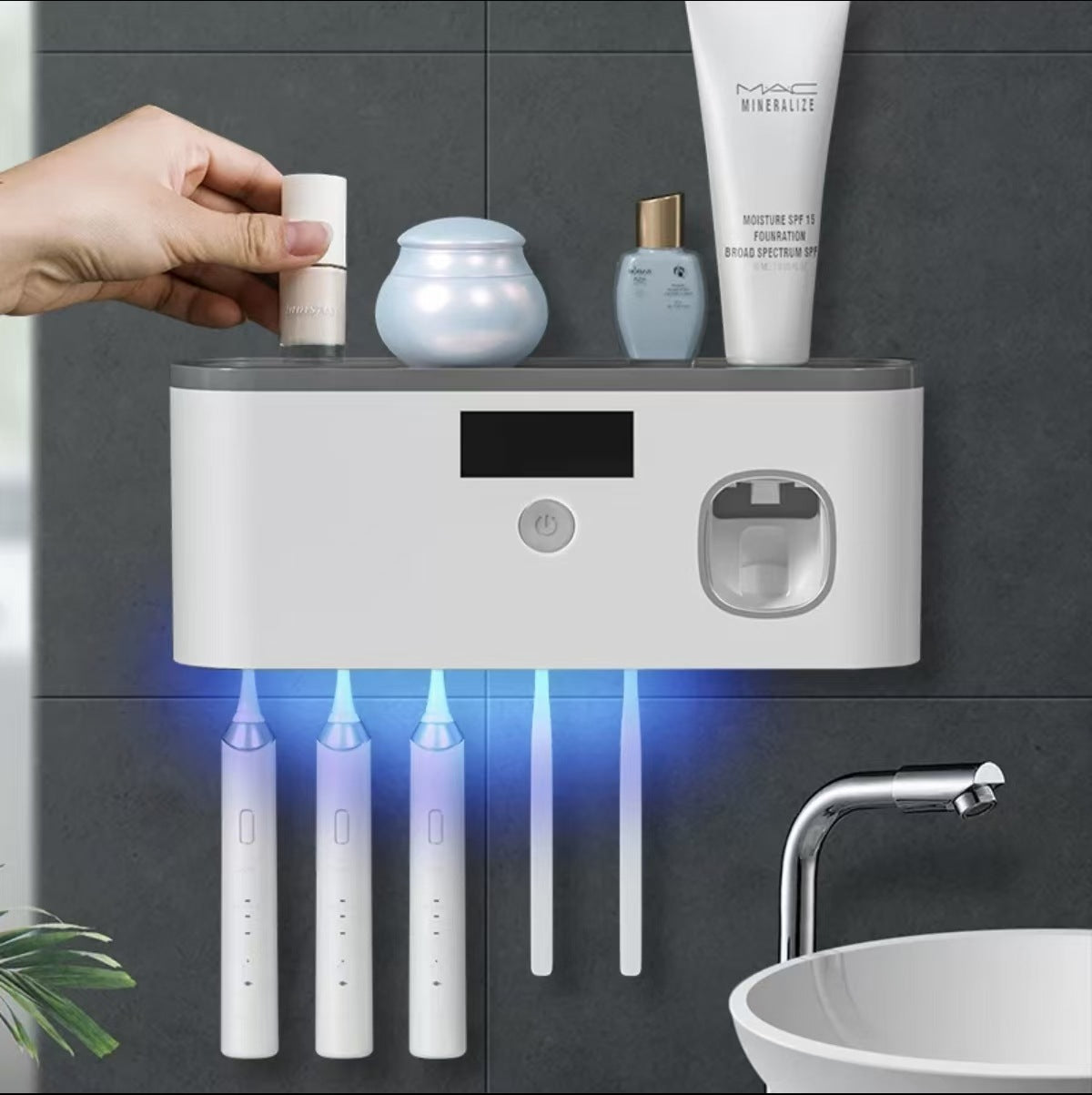 UV Sterilizing Toothbrush Holder in white with a rectangular display, round control button, and hanging toothbrush slots