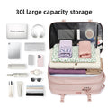 Vacuum Compression Travel Backpack in blush pink opens to reveal folded clothing beneath a mesh organizer panel and compact travel essentials