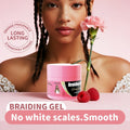 VIBE Haircare Braid Styling Gel in a pink tub, with a matching pink lid and black label beside raspberries