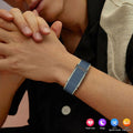VIBE LOOP™ Air Fitness Wristband Monitor with a blue woven strap and rectangular silver-toned clasp worn on the wrist