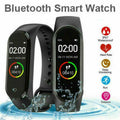 VIBE LOOP Ban smartwatch in black silicone with slim touch displays showing time and steps, plus waterproof and fitness icons