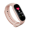 VIBE LOOP Ban M7 smart bracelet in pale pink silicone with a black touchscreen displaying heart rate and health metrics
