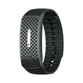 VIBE LOOP Ban Mosquito wristband in black silicone with a checkerboard face, slim silver control and adjustable strap