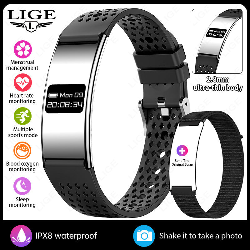 VIBE LOOP Ban smart wristband with a polished silver curved display and black perforated silicone strap, plus spare band