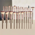VIBE LOOP BANS Makeup brushes with rose gold handles and varied soft brown and cream synthetic bristles